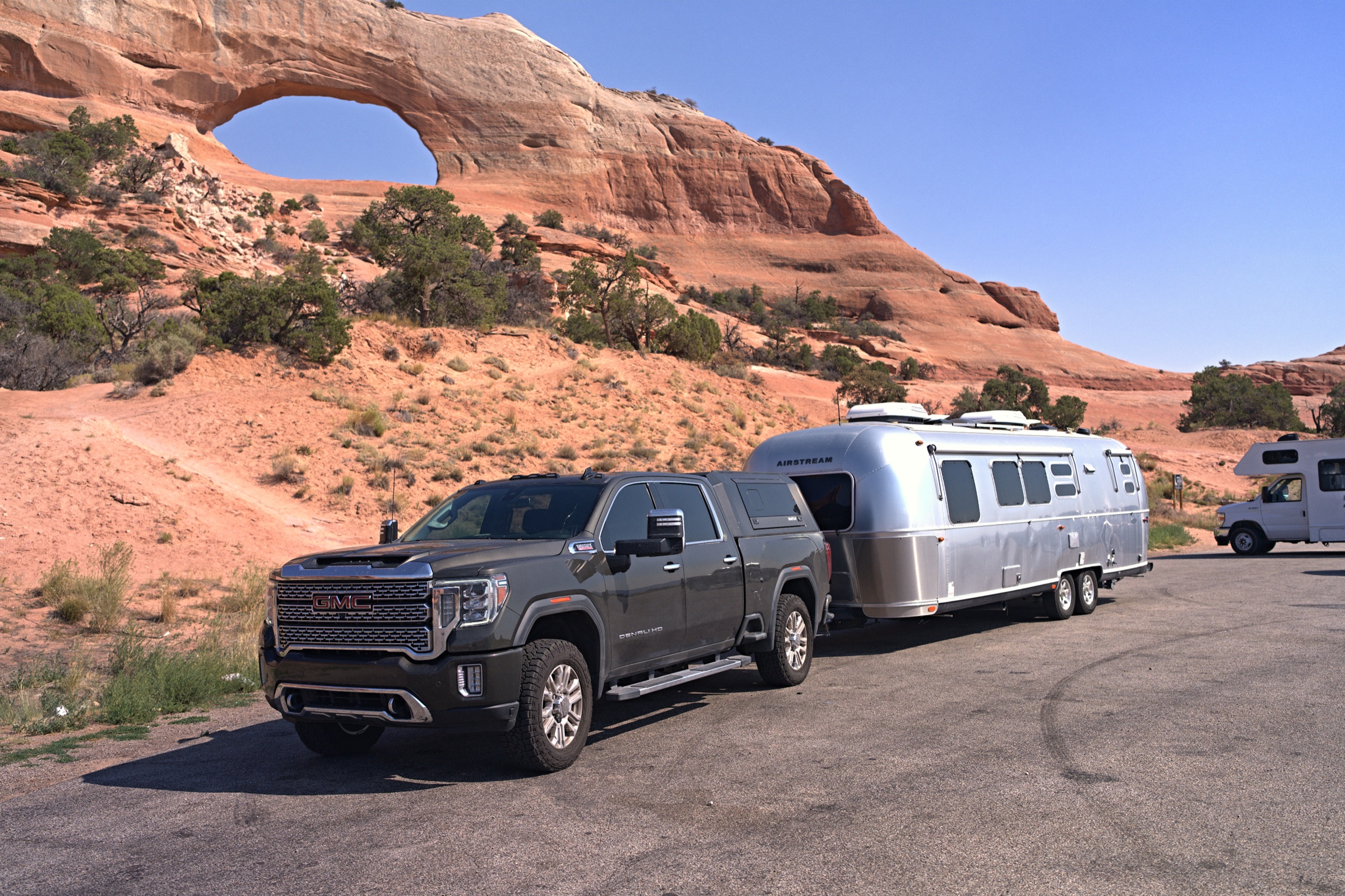 GMC Sierra and Airstream beneath Wilson Arch near Moab