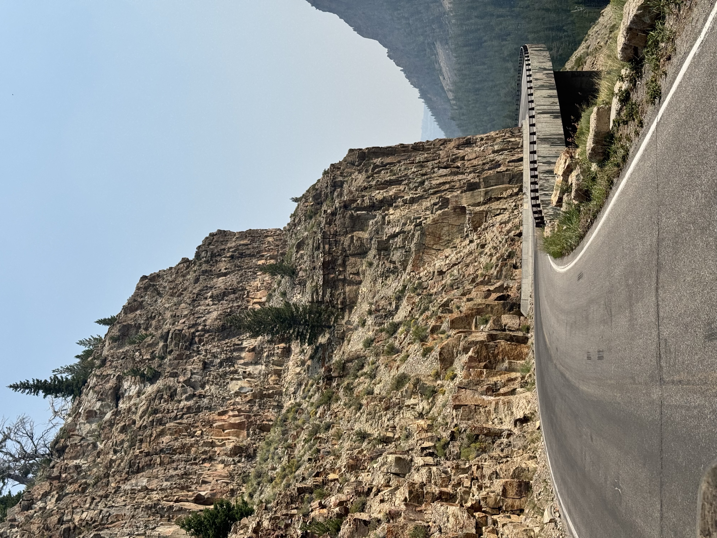 Mountain road and cliff transition toward Glacier